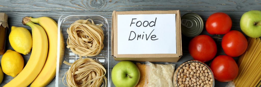 Concept of food drive with meal on wooden table