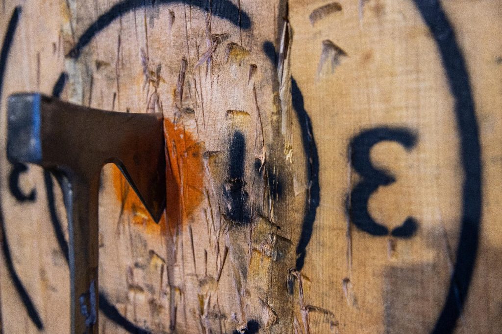 Axe Throwing Axe hitting bullseye in target