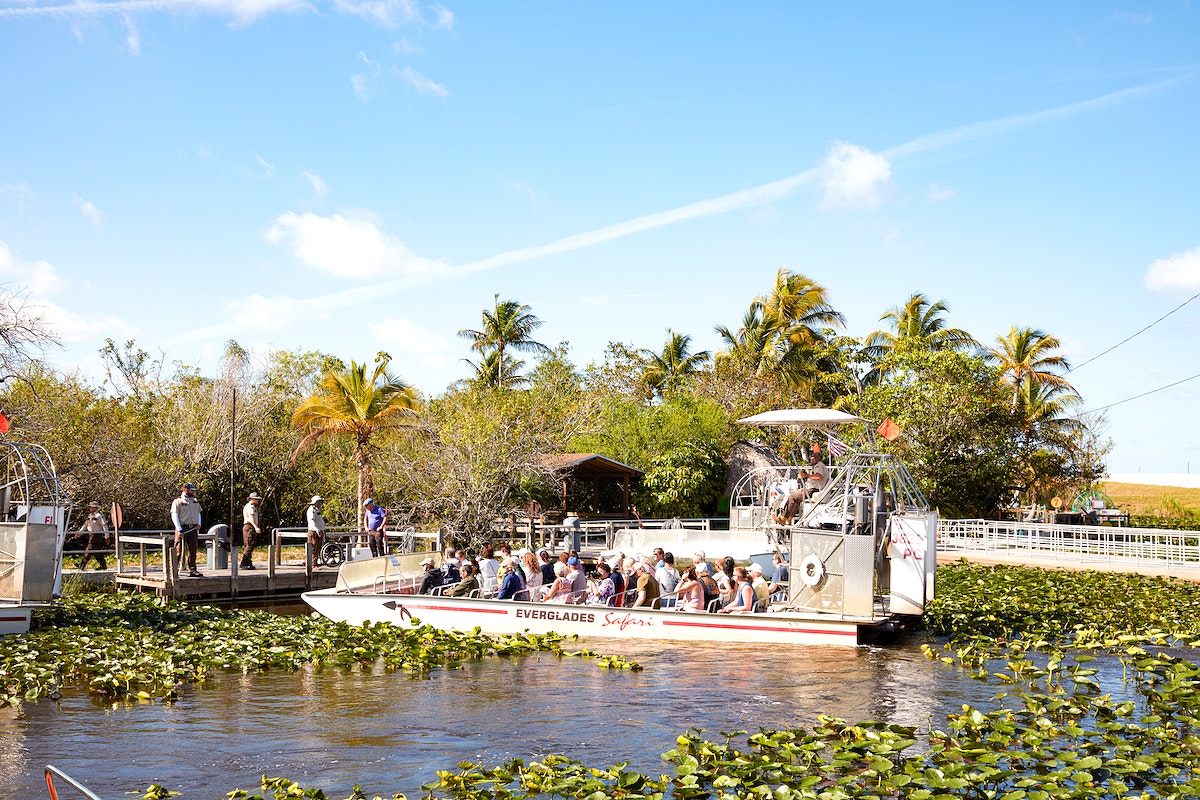 Airboat passengers take their places at the Everglades Safari Park. Original image from Carol M. Highsmiths America, Library of Congress collection. Digitally enhanced by rawpixel.